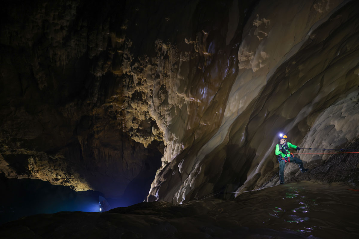 Visitors climb down during a tour in Son Doong cave, one of the world's largest natural caves, in central Vietnam's Quang Binh province on January 19, 2021.  Photo by Ngo Tran Hai An.